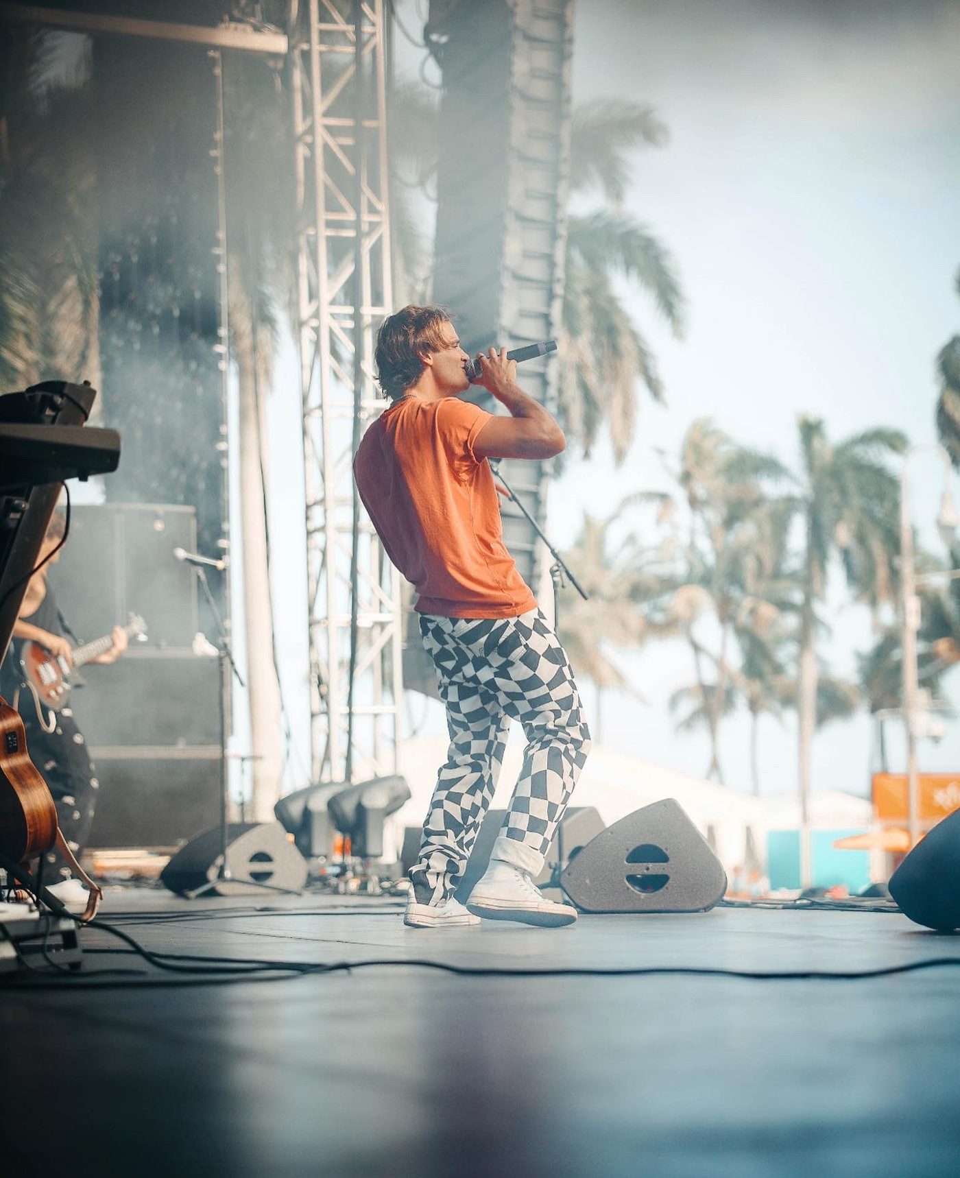 Marco singing under the palms at SunFest