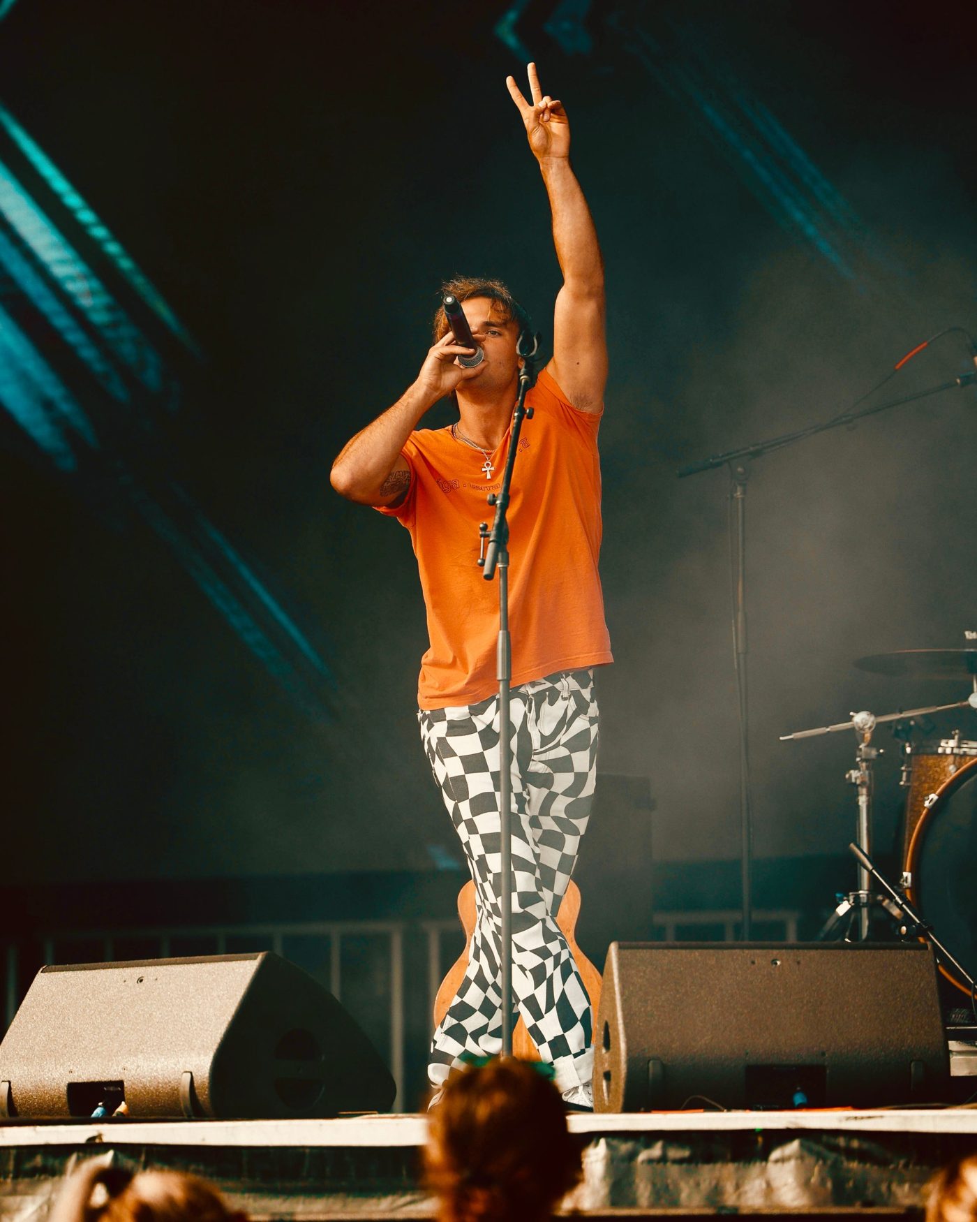 Marco throwing a peace sign on the SunFest stage